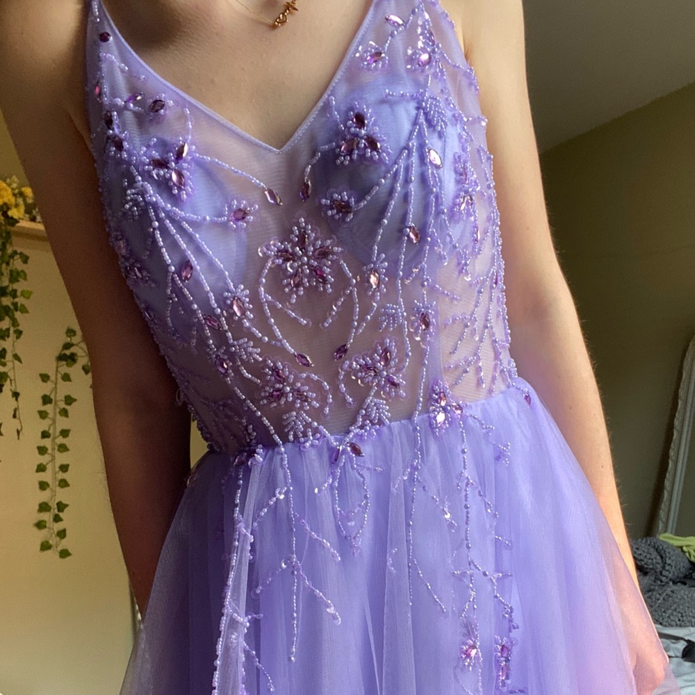 A purple fairylike prom dress